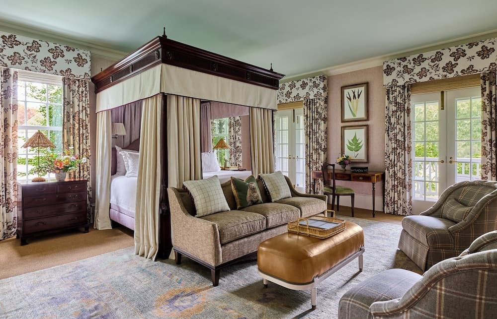 Mayflower Inn & Spa Auberge Collection guest suite in Washington, Connecticut with a canopy bed and New England country decor