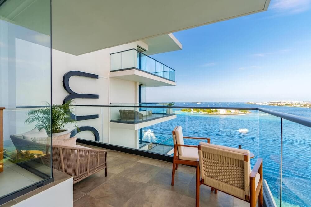 Balcony at Barceló Nasandhura Malé overlooking the harbor and turquoise water