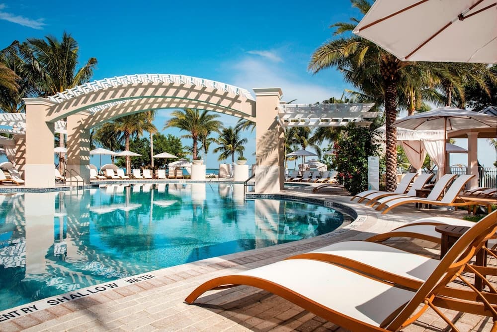 Playa Largo Resort & Spa waterfront property with palms and turquoise bay in Key Largo, Florida